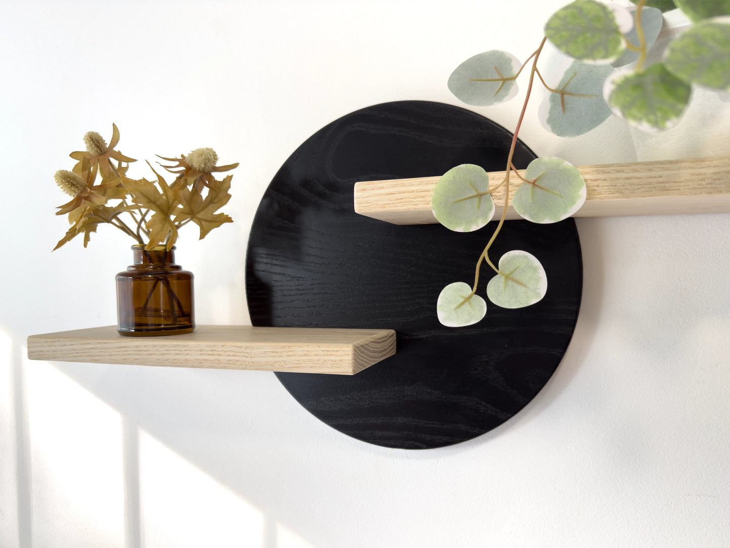 round mid century wall shelf for plants, black and white hardwood