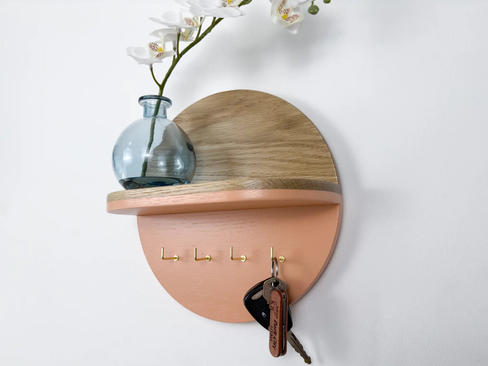 round wall mounted key holder with shelf, white oak and pink with brass l hooks