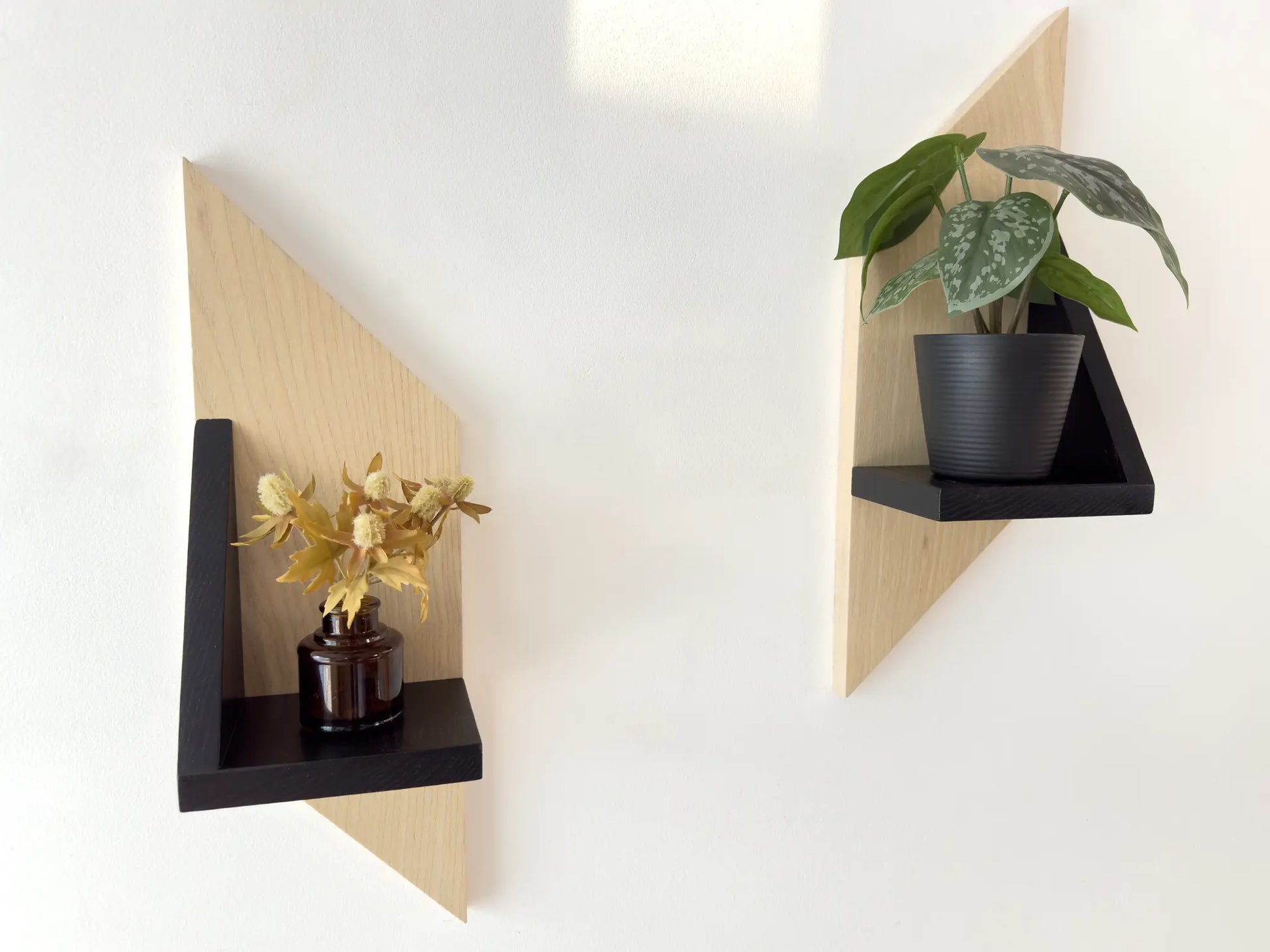 mid century modern wall shelf for plants, set of two in black and white, front view 