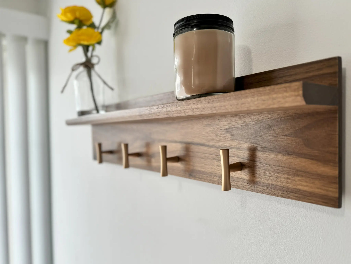 walnut coat rack and shelf, champagne t hooks, close up angled view  